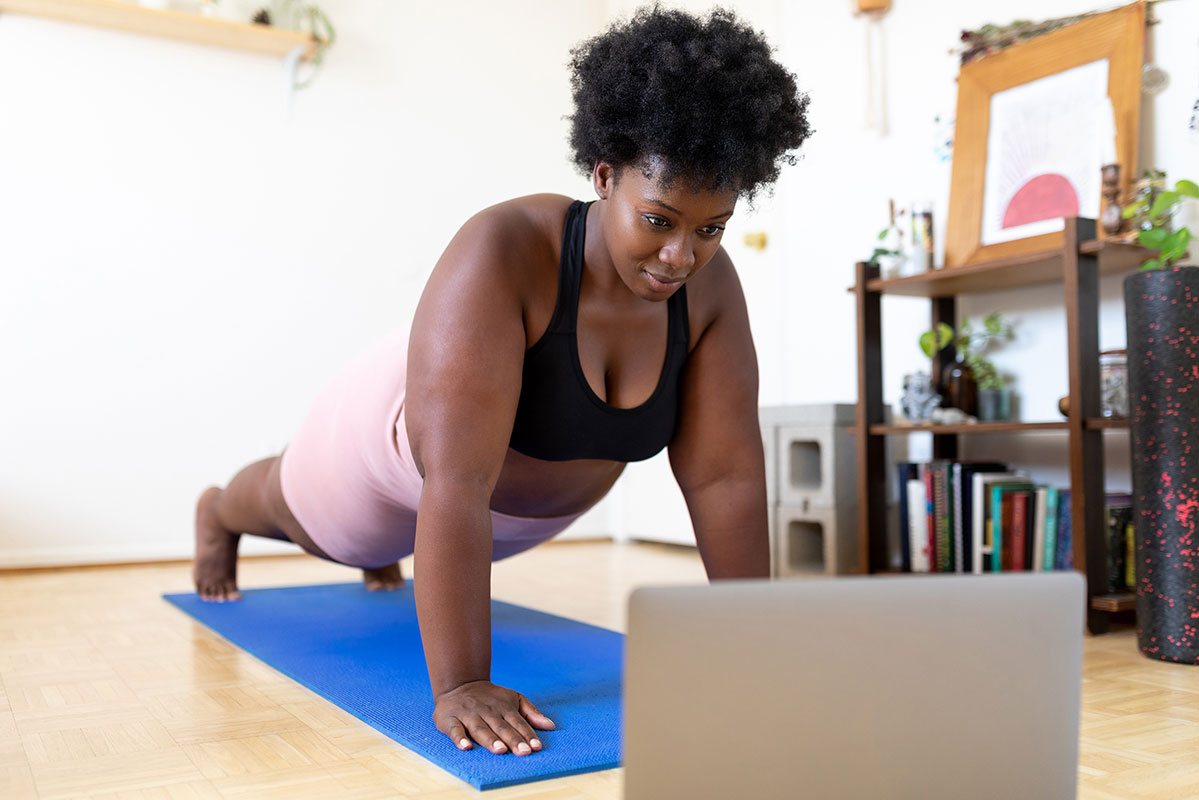 woman practicing yoga at home