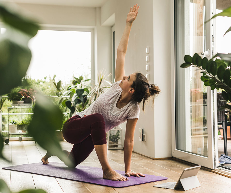 woman doing yoga at home