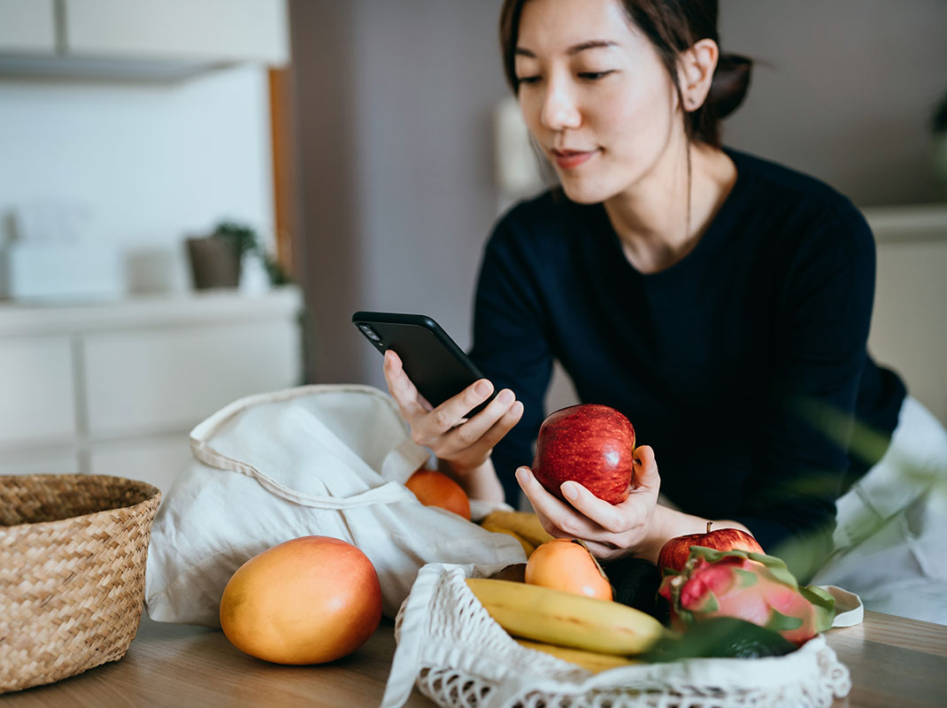 woman checking nutrition info on her phone