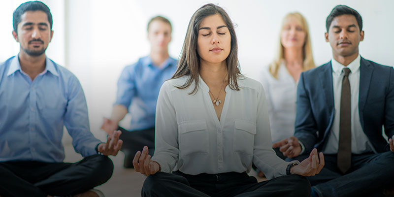 business people meditating