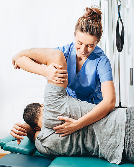 physical therapist working with client